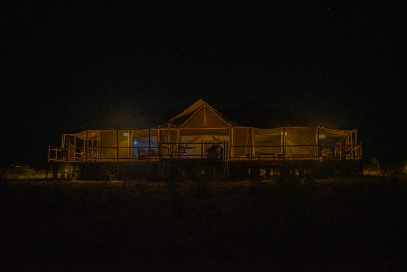 Central mess tent illuminated at night